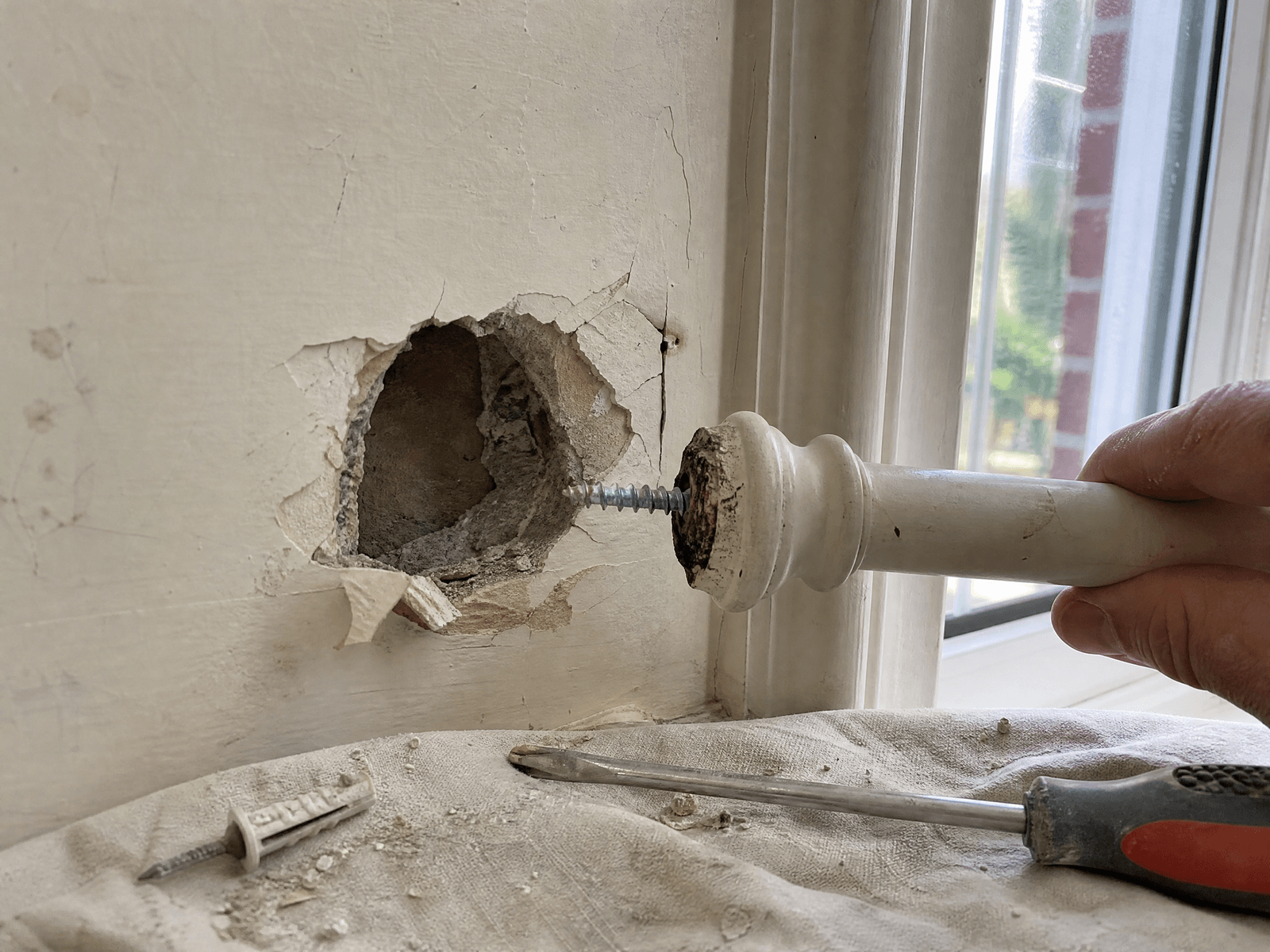 Close-up detail relevant to curtain pole and blind fitting — showing materials and installation technique
